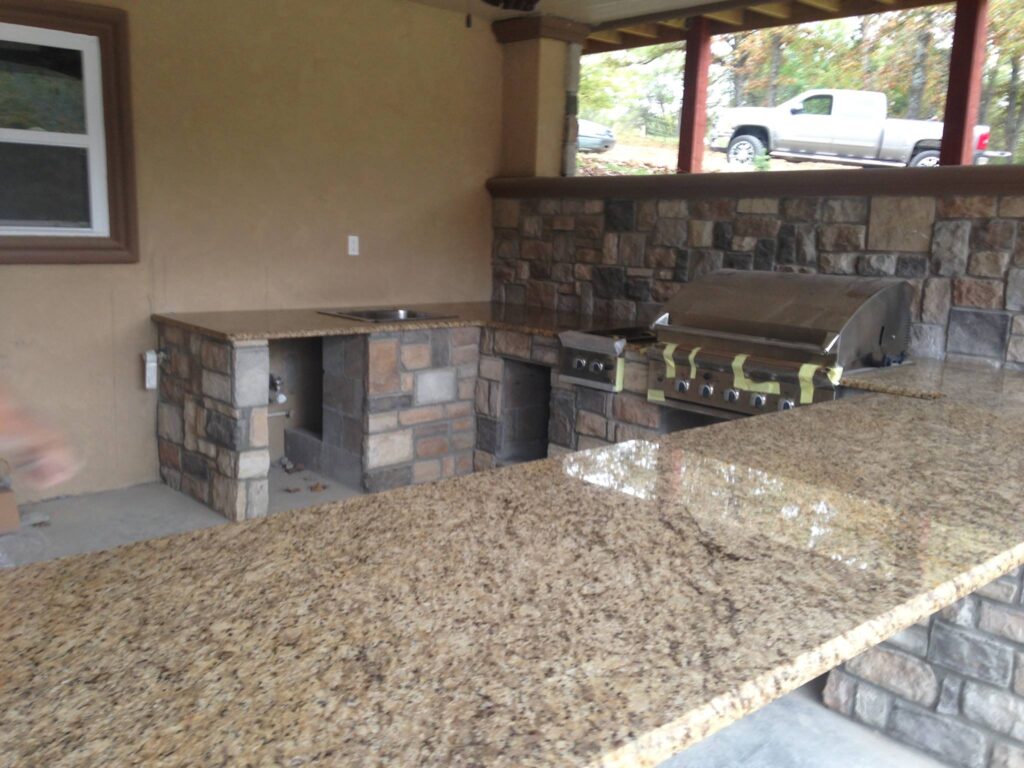 outdoor kitchen with stone counters