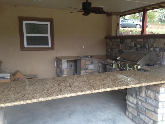 large outdoor kitchen with custom countertops